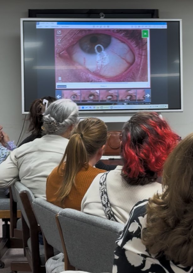 Training session reviewing a forensic exam image